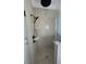 Modern shower with pebble flooring, tiled accents, and a shower bench at 740 Jade Dr., Myrtle Beach, SC 29579