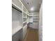 Custom walk-in closet with built in shelving, drawers, and plenty of hanging space at 740 Jade Dr., Myrtle Beach, SC 29579
