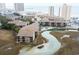 Aerial view of condo complex with water feature and beach access in a popular coastal community at 9501 Shore Dr. # A309, Myrtle Beach, SC 29572