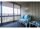 Relaxing balcony with striped cushions and tranquil water view at 9501 Shore Dr. # A309, Myrtle Beach, SC 29572