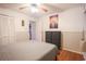 Bedroom with ceiling fan, gray comforter, and a view out to the rest of the home at 9501 Shore Dr. # A309, Myrtle Beach, SC 29572