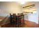Dining room with table and chairs, and a kitchen bar with stools at 9501 Shore Dr. # A309, Myrtle Beach, SC 29572