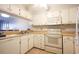 Efficient kitchen featuring white cabinets, appliances, and a convenient layout for cooking at 9501 Shore Dr. # A309, Myrtle Beach, SC 29572