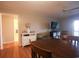 Living room with a table, couch, TV, and a doorway leading into another room at 9501 Shore Dr. # A309, Myrtle Beach, SC 29572