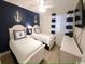 Nautical themed bedroom with twin beds and accent wall at 9580 Shore Dr. # 107, Myrtle Beach, SC 29572