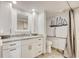 Accessible bathroom featuring a walk-in shower with grab bars, vanity with marble countertop and ample storage at 9650 Shore Dr. # 503, Myrtle Beach, SC 29572