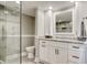Modern bathroom featuring white vanity with marble countertop and a glass-enclosed shower at 9650 Shore Dr. # 503, Myrtle Beach, SC 29572