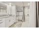Accessible bathroom featuring a walk-in shower with grab bars, vanity with marble countertop and ample storage at 9650 Shore Dr. # 503, Myrtle Beach, SC 29572