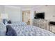 Comfortable guest bedroom with two beds, stylish coastal decor, and a view into adjacent rooms at 9650 Shore Dr. # 503, Myrtle Beach, SC 29572