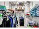 Organized closet with metal shelving, clothing, towels, and personal items neatly arranged at 9650 Shore Dr. # 503, Myrtle Beach, SC 29572