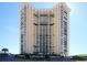 Stunning exterior shot of the beachfront high-rise condo community with well-manicured landscaping at 9650 Shore Dr. # 503, Myrtle Beach, SC 29572