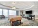 Spacious game room featuring a pool table, seating, and a large window at 9650 Shore Dr. # 503, Myrtle Beach, SC 29572