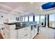Open-concept kitchen with granite countertops, stainless steel appliances, and white cabinetry at 9650 Shore Dr. # 503, Myrtle Beach, SC 29572