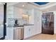 Bright kitchen features white cabinets, granite counters, stainless steel appliances, and tiled backsplash at 9650 Shore Dr. # 503, Myrtle Beach, SC 29572