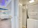 Compact laundry area with a stacked washer and dryer set, maximizing space and convenience in the home at 9650 Shore Dr. # 503, Myrtle Beach, SC 29572