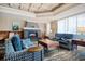 Inviting living room with a coffered ceiling, stone fireplace, and comfortable seating arrangements at 9650 Shore Dr. # 503, Myrtle Beach, SC 29572