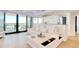 Stylish living room with a white leather sectional sofa, a modern kitchen, and an ocean view at 9650 Shore Dr. # 503, Myrtle Beach, SC 29572