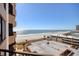Coastal view from a balcony overlooking the beach, ocean, and a parking area at 9650 Shore Dr. # 503, Myrtle Beach, SC 29572