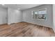 Bright bedroom featuring wood-look floors, neutral paint, and a large window with views of the construction at 1018 Laconic Dr., Myrtle Beach, SC 29588