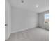 This bedroom features neutral walls and carpet, plus a bright window for natural light at 1018 Laconic Dr., Myrtle Beach, SC 29588