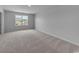 This bedroom features neutral walls and carpet, plus a bright window for natural light at 1018 Laconic Dr., Myrtle Beach, SC 29588