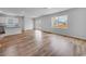 Spacious living room with an eat-in kitchen with luxury vinyl plank flooring and natural light at 1018 Laconic Dr., Myrtle Beach, SC 29588