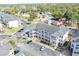 Aerial view displays condo complex with ample parking and convenient access to local amenities and nearby residential areas at 1058 Sea Mountain Hwy. # 202, North Myrtle Beach, SC 29582