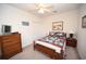 Bright bedroom featuring a bed, wood dresser and coastal decor with natural light at 1058 Sea Mountain Hwy. # 202, North Myrtle Beach, SC 29582