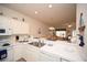 Cozy kitchen open to living area features white cabinetry and modern appliances at 1058 Sea Mountain Hwy. # 202, North Myrtle Beach, SC 29582