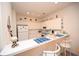 Well-lit kitchen with white cabinetry, modern appliances and a breakfast bar for casual dining at 1058 Sea Mountain Hwy. # 202, North Myrtle Beach, SC 29582