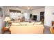 Well-lit living room with marine-themed decorations, a ceiling fan, and sliding glass doors at 1058 Sea Mountain Hwy. # 202, North Myrtle Beach, SC 29582