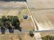 An aerial view of a white two story home on large property with farm fields at 11455 W Highway 19, Loris, SC 29569