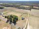 A bird's eye view of the home nestled among trees and open farm land at 11455 W Highway 19, Loris, SC 29569