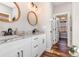 Bright bathroom featuring granite countertops, modern fixtures, and a framed mirror at 11455 W Highway 19, Loris, SC 29569