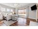 Primary bedroom featuring hardwood floors, natural light, ceiling fan and neutral walls at 11455 W Highway 19, Loris, SC 29569