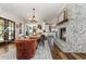 Spacious dining area featuring an ornate area rug, fireplace, and a view into the kitchen area at 11455 W Highway 19, Loris, SC 29569