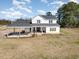 Charming two-story home with white siding, covered porch, and carport at 11455 W Highway 19, Loris, SC 29569