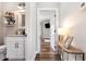 Hallway featuring hardwood floors and leading to the bedroom at 11455 W Highway 19, Loris, SC 29569