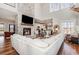 Bright living room featuring a fireplace, high ceilings, an open floor plan, and lots of natural light at 11455 W Highway 19, Loris, SC 29569