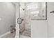 Modern bathroom with a glass enclosed shower showcasing tile work and mosaic flooring at 119 Sunset Dr., Murrells Inlet, SC 29576