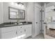 Bathroom featuring double sinks, granite counters and modern fixtures and a doorway at 119 Sunset Dr., Murrells Inlet, SC 29576