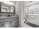 A well-lit full bathroom with granite countertop and combo tub and shower at 119 Sunset Dr., Murrells Inlet, SC 29576