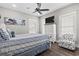 Bedroom featuring a dark dresser with TV, chair, and nautical themed decor at 119 Sunset Dr., Murrells Inlet, SC 29576