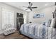 This bedroom offers a ceiling fan, television, starfish chair, and a nautical theme at 119 Sunset Dr., Murrells Inlet, SC 29576