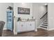 A coffee bar is situated alongside the stairs, with a decorative shelf adding to the space's charm at 119 Sunset Dr., Murrells Inlet, SC 29576