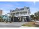 Charming two-story coastal home with a spacious porch, sturdy support beams, and a well-maintained yard at 119 Sunset Dr., Murrells Inlet, SC 29576