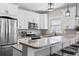 Well-lit kitchen featuring stainless steel appliances, granite counters, and ample cabinet space at 119 Sunset Dr., Murrells Inlet, SC 29576