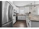 Bright kitchen with stainless steel appliances, black hardware and granite countertops at 119 Sunset Dr., Murrells Inlet, SC 29576