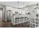 Bright kitchen with white cabinetry, granite countertops, and modern appliances at 119 Sunset Dr., Murrells Inlet, SC 29576