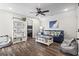 Beach themed living room with sofa, bookcase and games at 119 Sunset Dr., Murrells Inlet, SC 29576